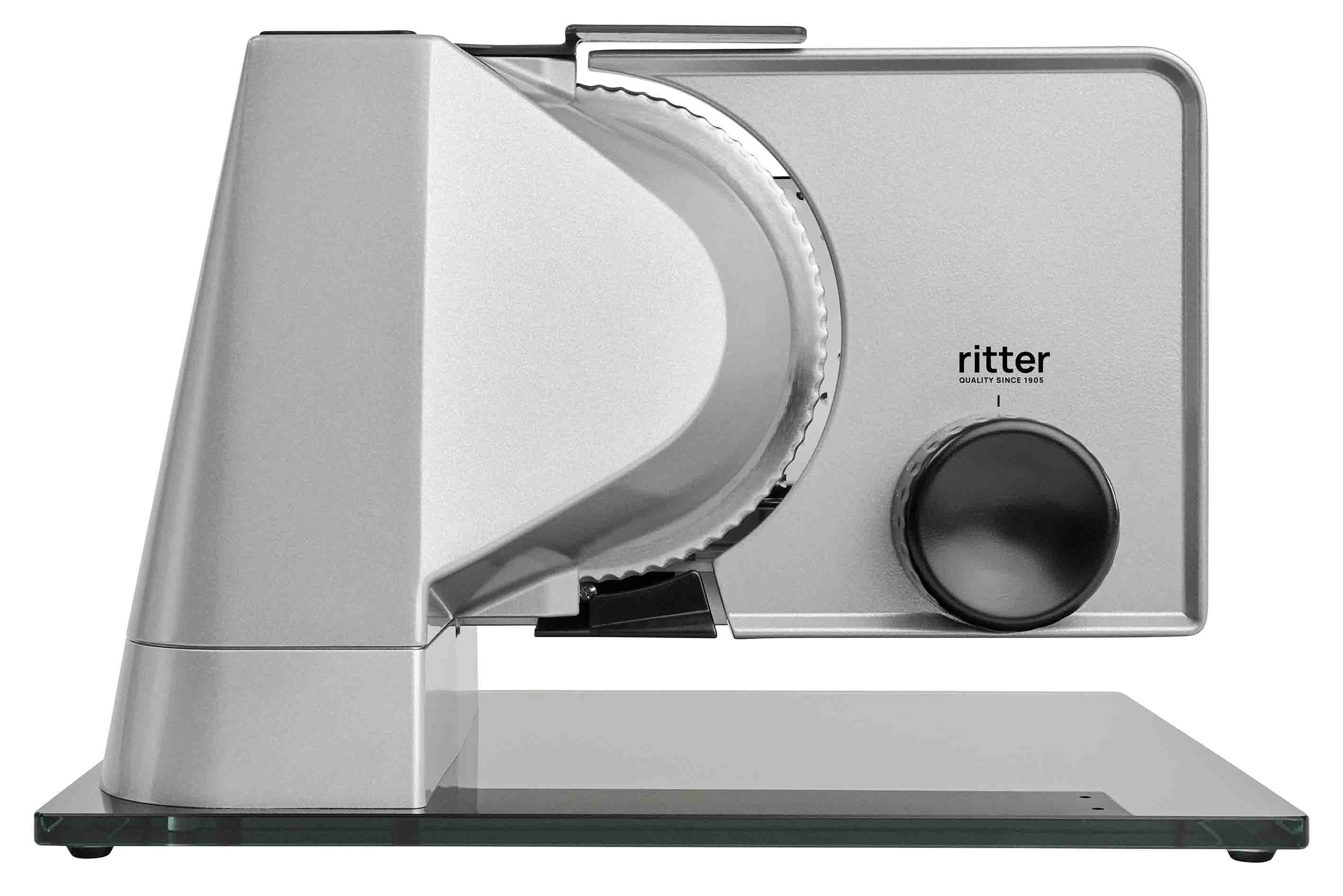 Electric food slicer in silver with black rotary knob and glass plate Electric food slicer in silver with black rotary knob and glass plate