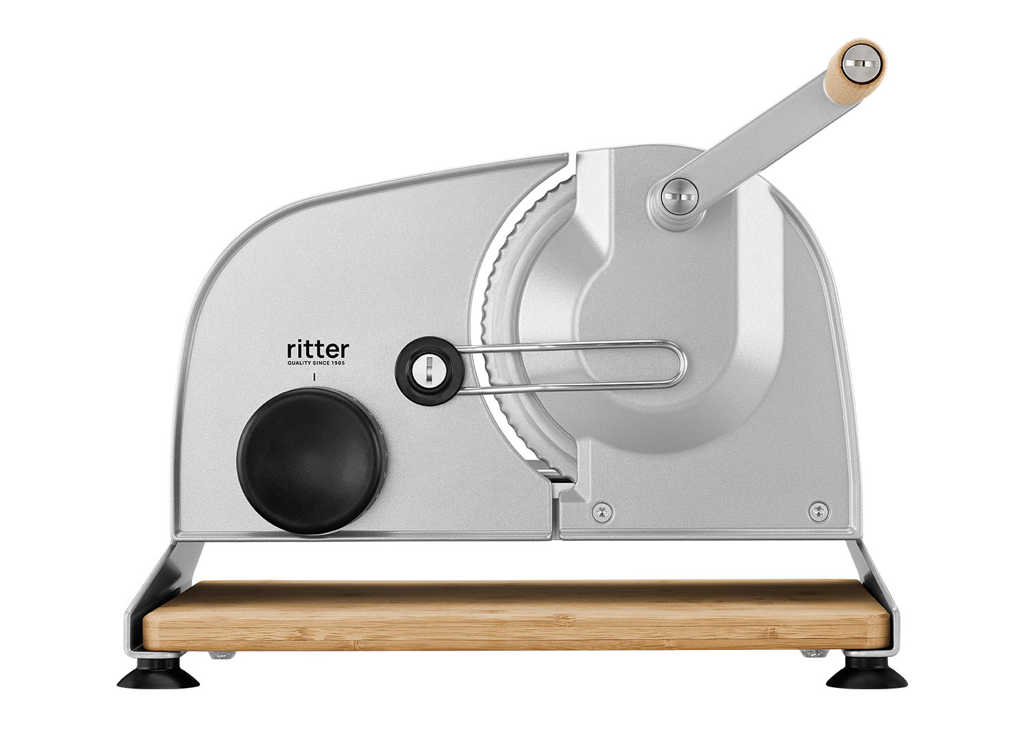 Silver manual food slicer of the brand ritter with black knob, handle and bamboo board
