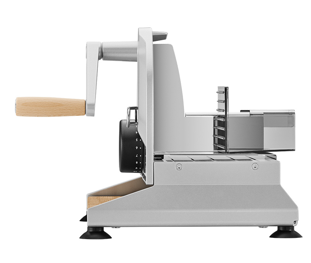 Silver manual food slicer of the brand ritter with black knob, handle and bamboo board from the right side