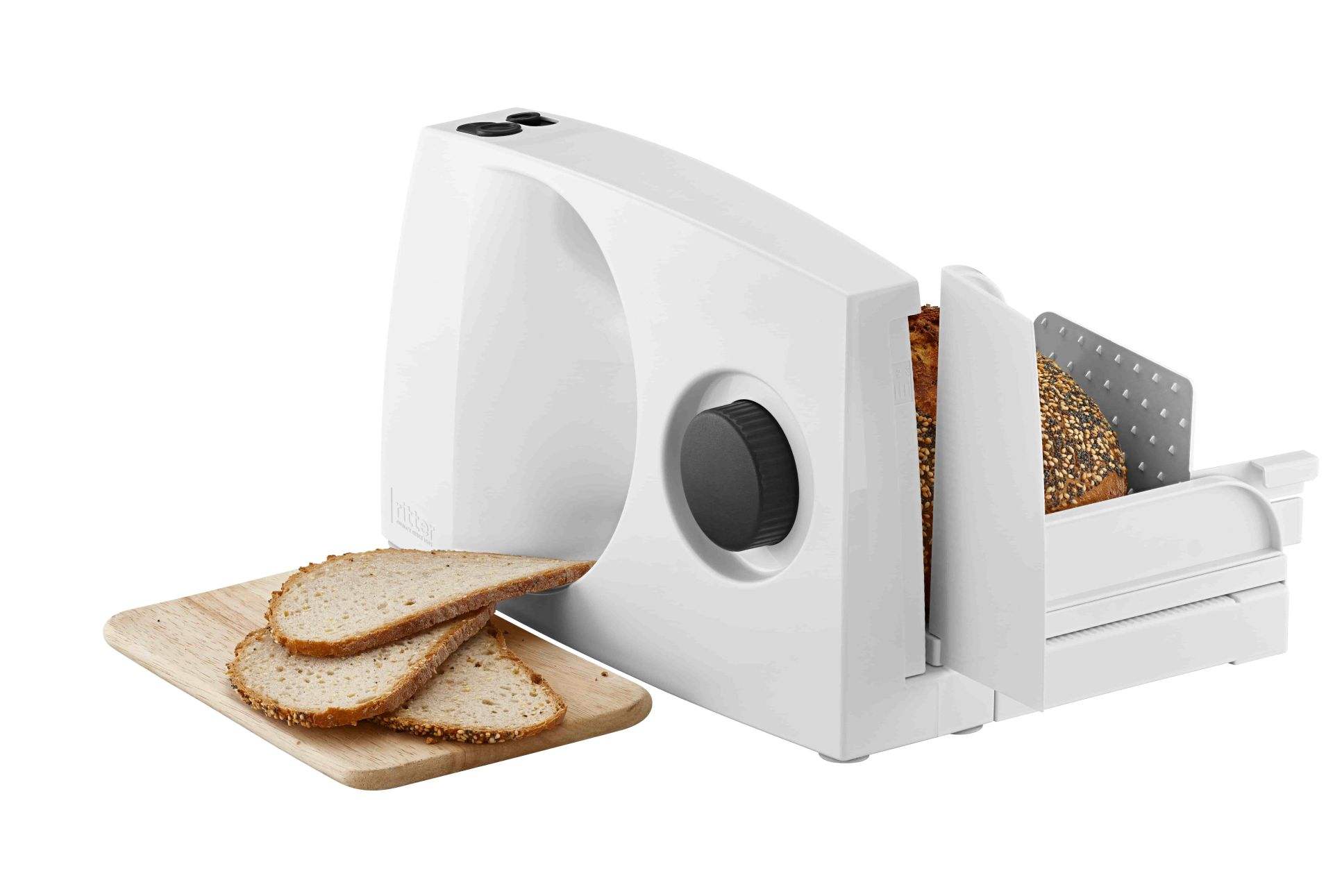 Weißer Allesschneider aus Kunststoff, seitliche Ansicht mit geschnittenem Brot