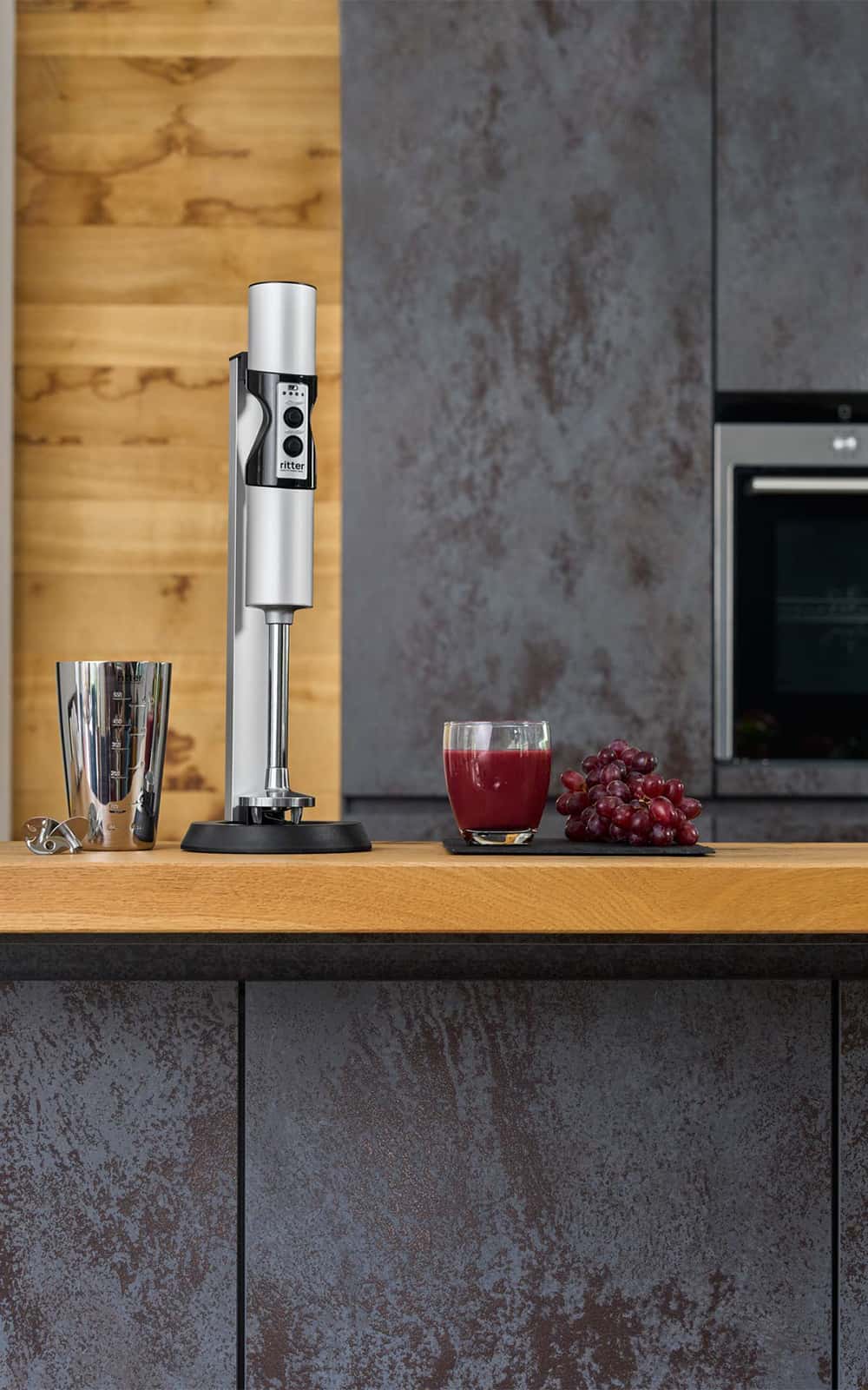 Hand blender in modern kitchen with stainless steel blender jug Hand blender in modern kitchen with stainless steel blender jug
