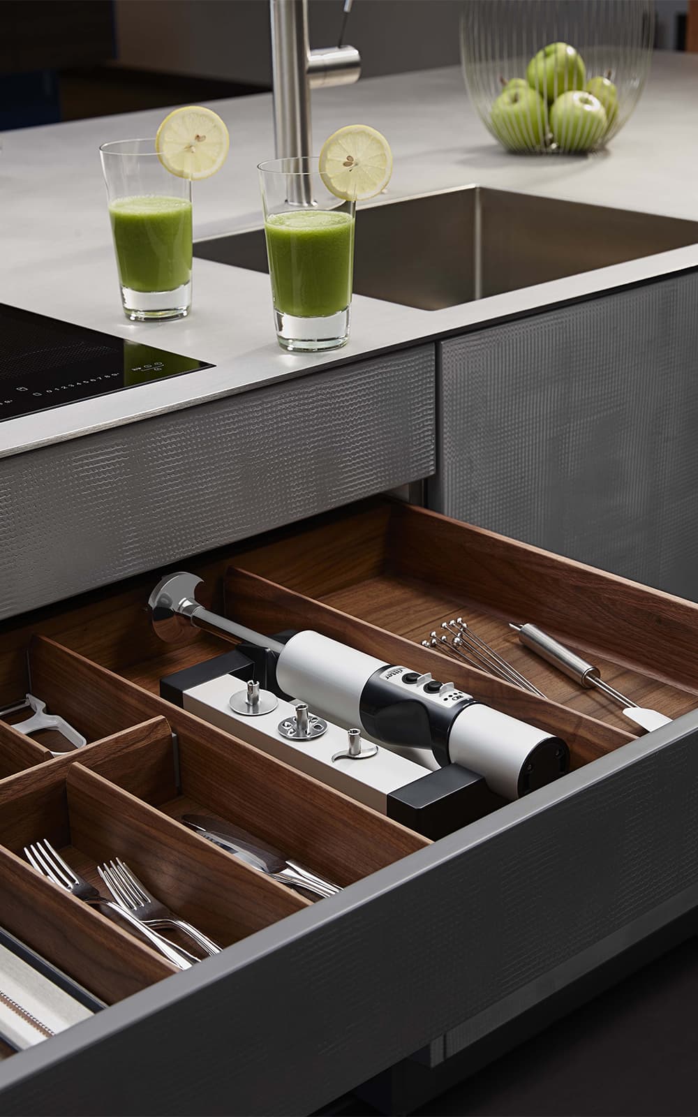 Built-in hand blender in a modern, dark kitchen Built-in hand blender in a modern, dark kitchen