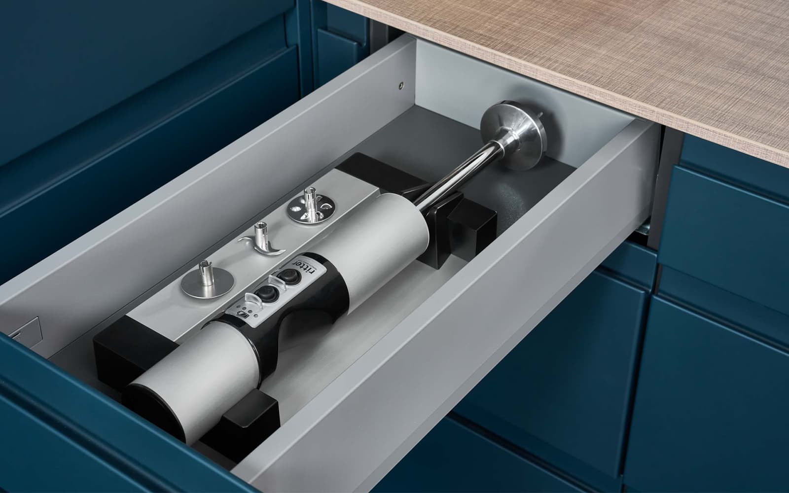Built-in hand blender in a drawer in a modern kitchen